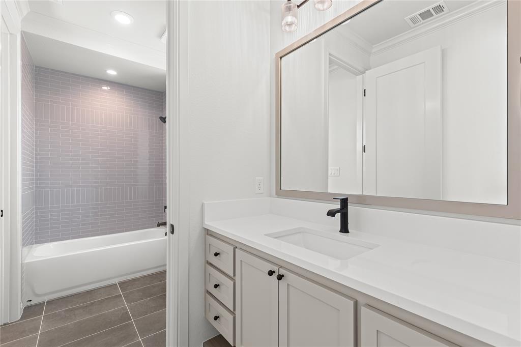 4720 Magnolia Trail Midlothian, TX 76065 - Photo 32 of 40 a bathroom with a sink a shower and a mirror