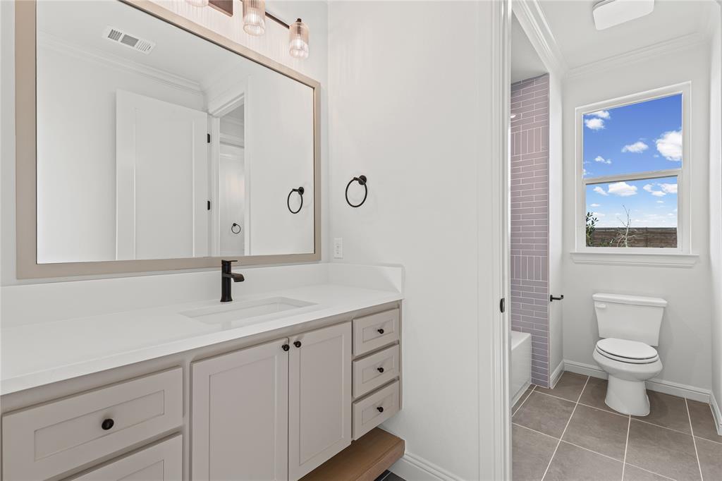4720 Magnolia Trail Midlothian, TX 76065 - Photo 34 of 40 a view of bathroom with a toilet sink and mirror