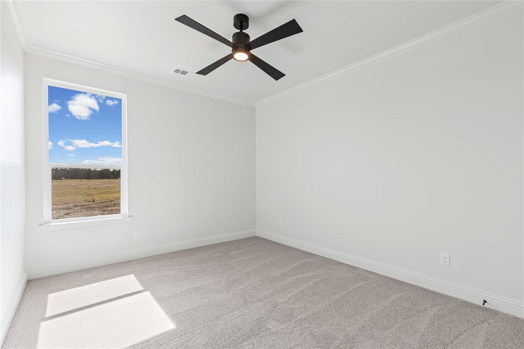 4720 Magnolia Trail Midlothian, TX 76065 - Photo 37 of 40 an empty room with a window and a ceiling fan