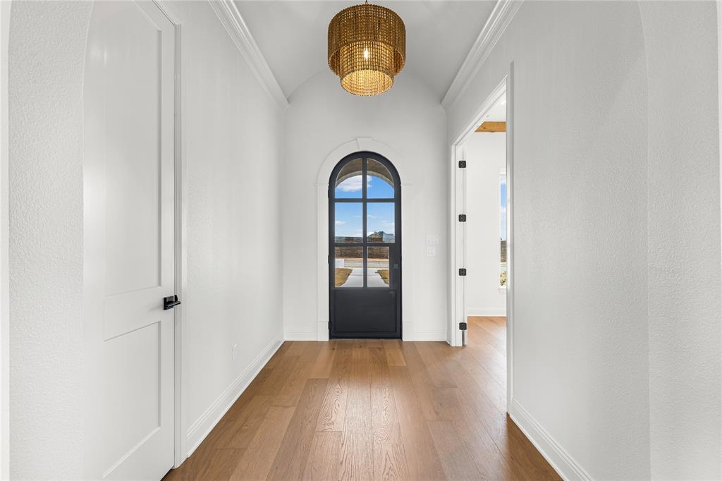 4720 Magnolia Trail Midlothian, TX 76065 - Photo 6 of 40 a view of a hallway view with wooden floor and front door