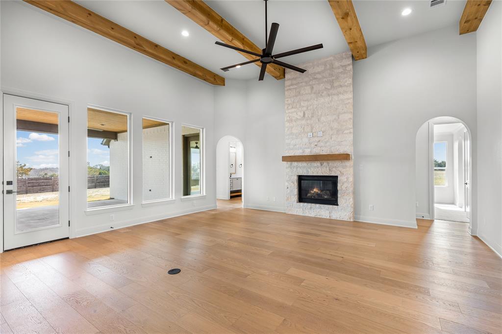 4720 Magnolia Trail Midlothian, TX 76065 - Photo 9 of 40 a view of an empty room with a fireplace and a window