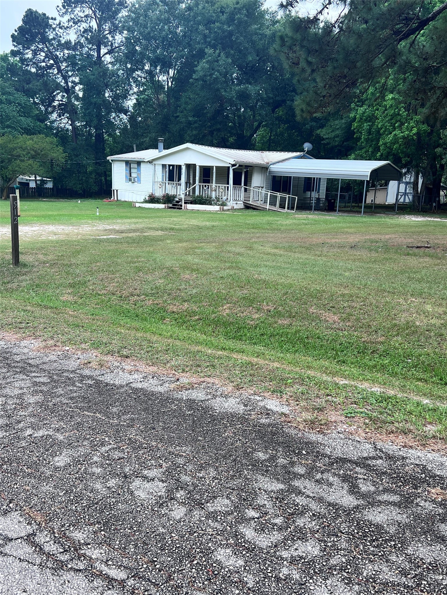 512 Cutter Drive Trinity, TX 75862 - Photo 2 of 21 Huge yard! Three lots totaling 1.08 acres.