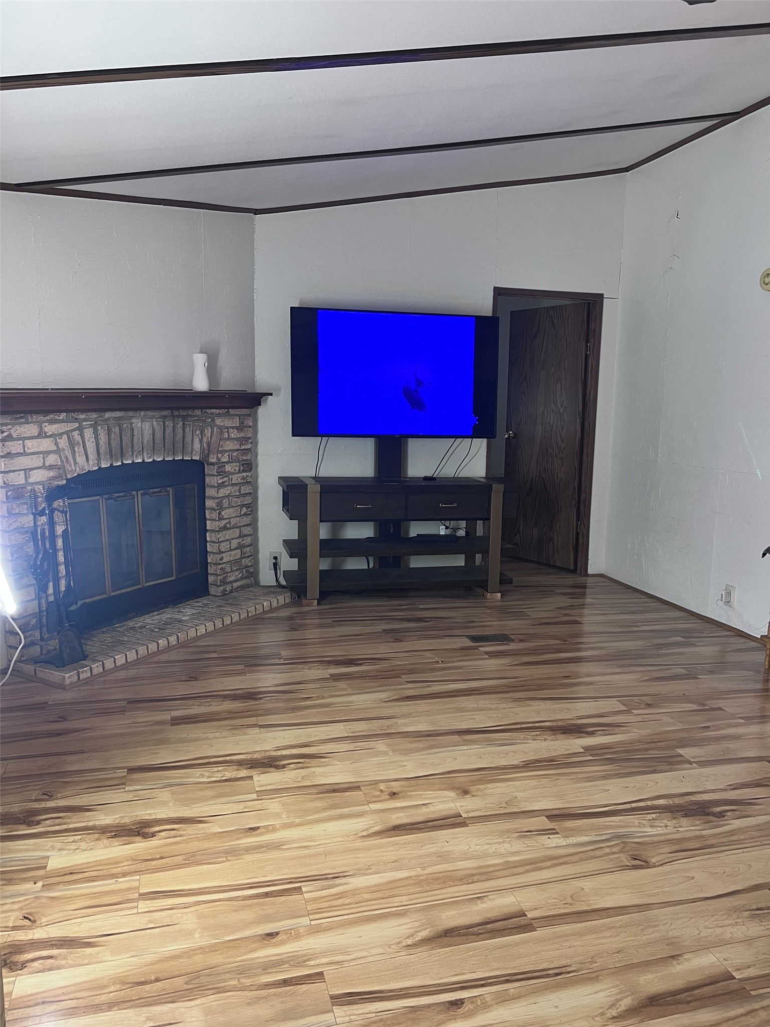 512 Cutter Drive Trinity, TX 75862 - Photo 10 of 21 Living room looking into the primary bedroom.