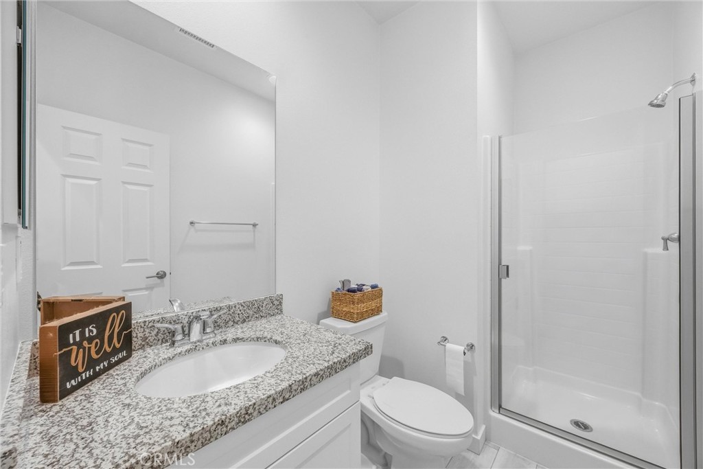 4247 Bravado Court Riverside, CA 92505 - Photo 17 of 60 Convenient downstairs bathroom features a walk-in shower