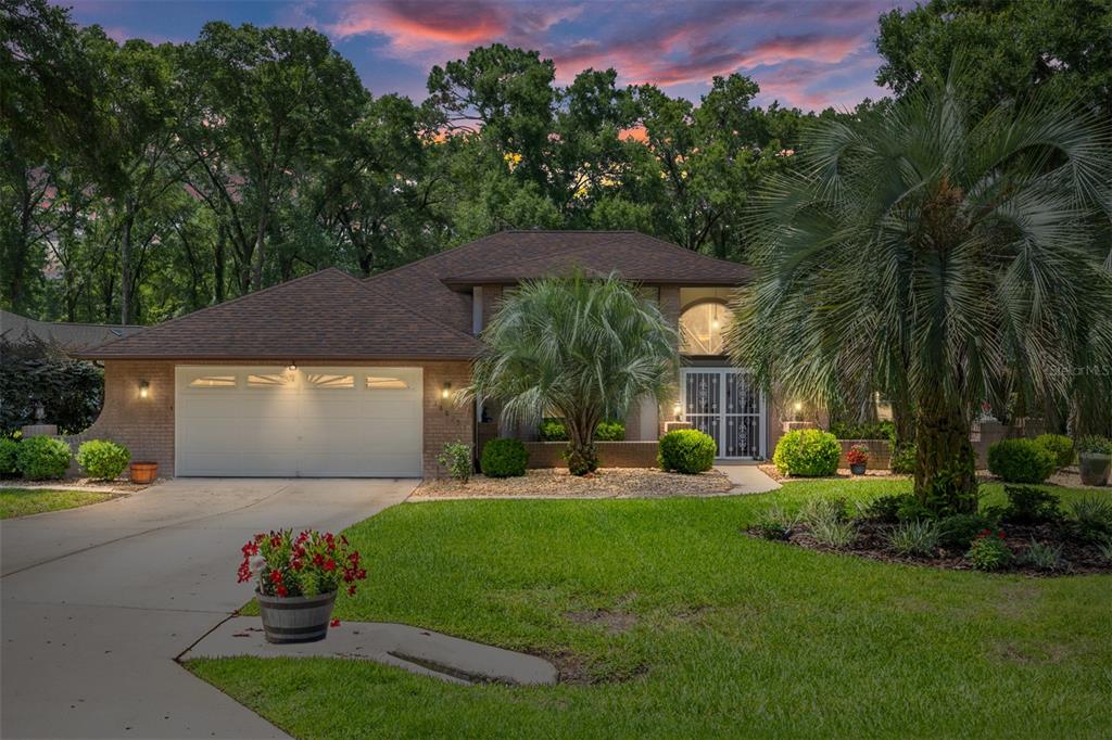 18825 Southwest 93rd Loop Dunnellon, FL 34432 - Photo 2 of 85 a front view of a house with garden