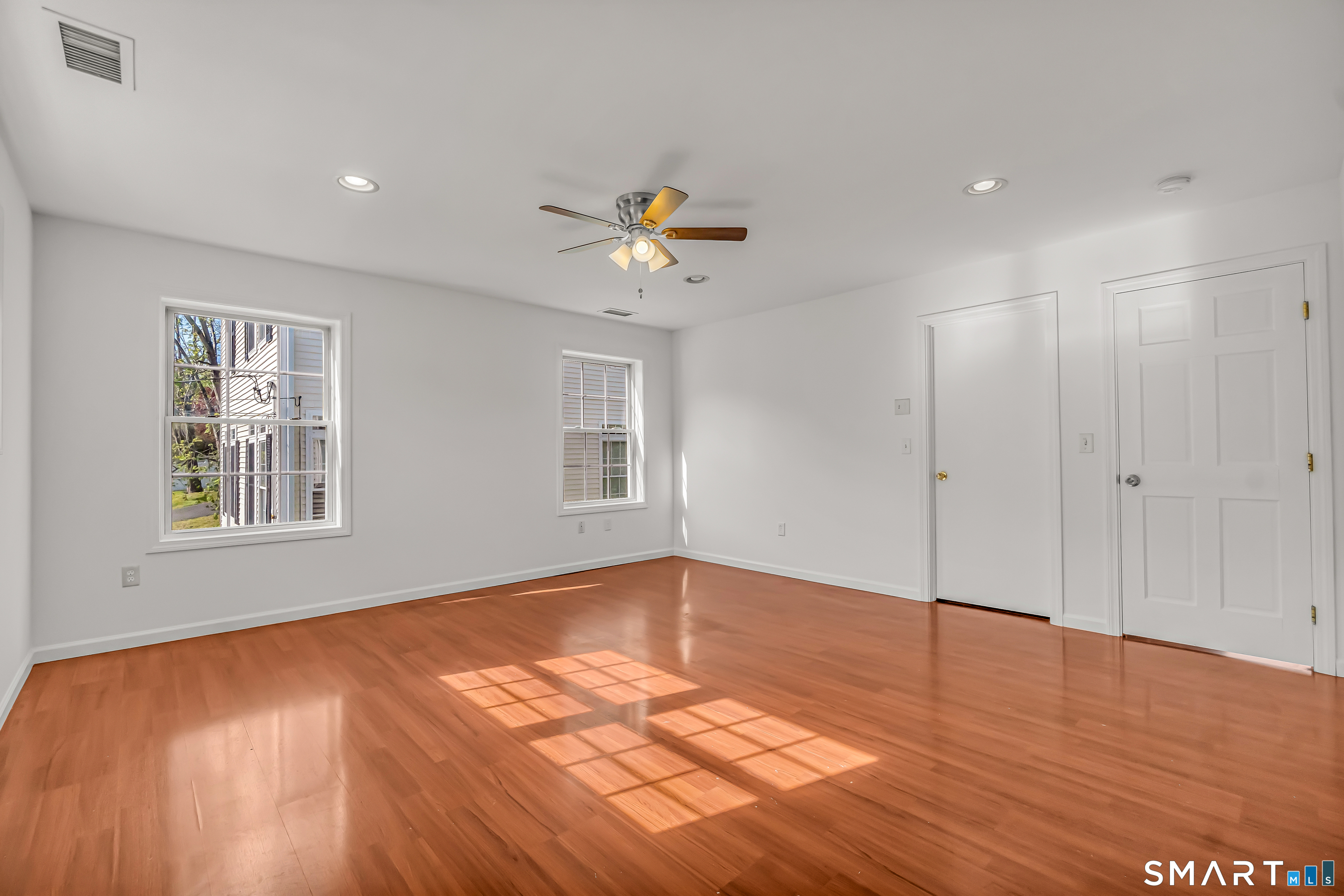 1770 Stratfield Road Fairfield, CT 06825 - Photo 30 of 40 a view of an empty room with window and wooden floor