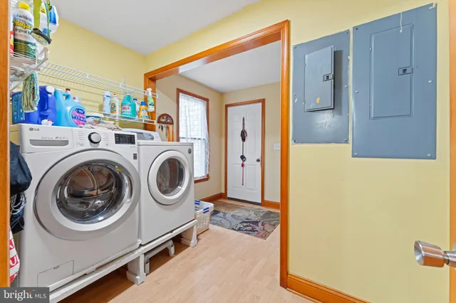 a view of a storage & utility room with washer and dryer