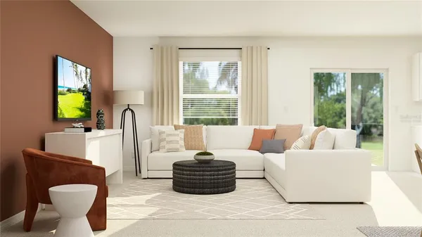 a living room with furniture a flat screen tv and a large window