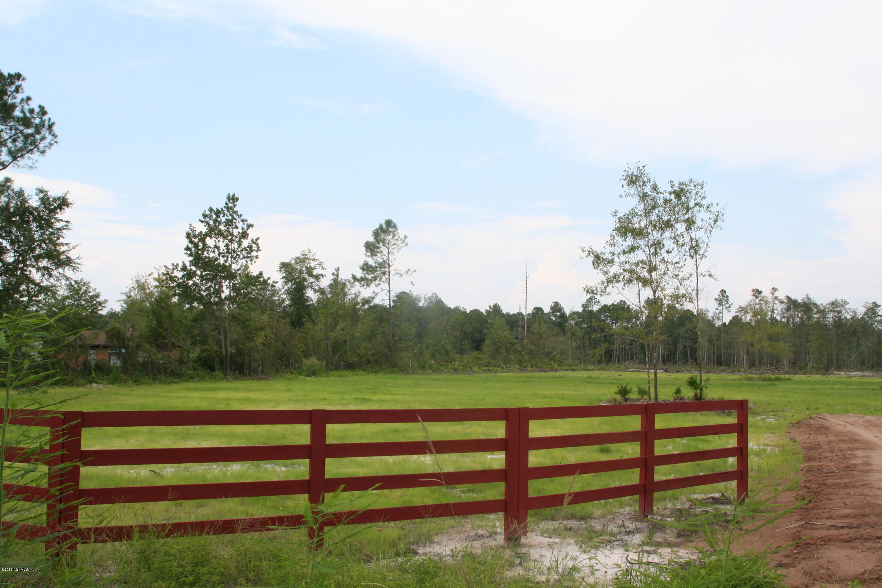 511 Randy Road Yulee, FL 32097 - Photo 8 of 10 a view of park with bench and trees