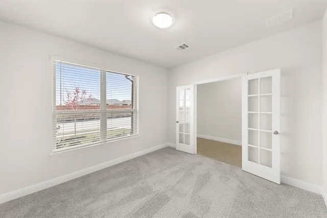 an empty room with windows