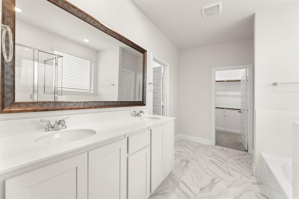 2029 Gladd Road Royse City, TX 75189 - Photo 14 of 27 a bathroom with a sink and a mirror