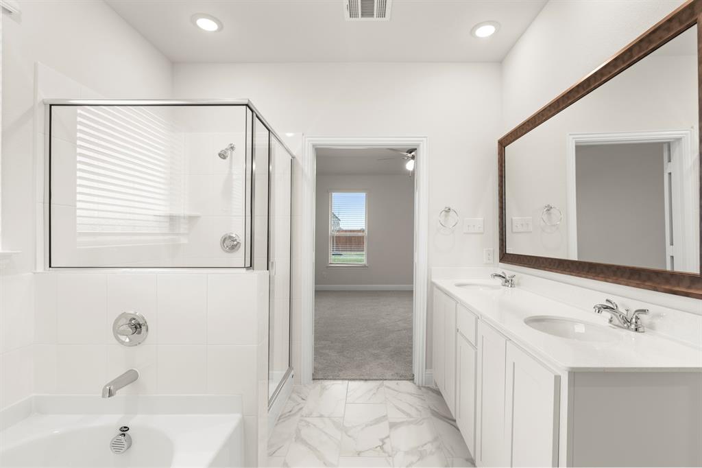 2029 Gladd Road Royse City, TX 75189 - Photo 16 of 27 a bathroom with a bathtub and a sink