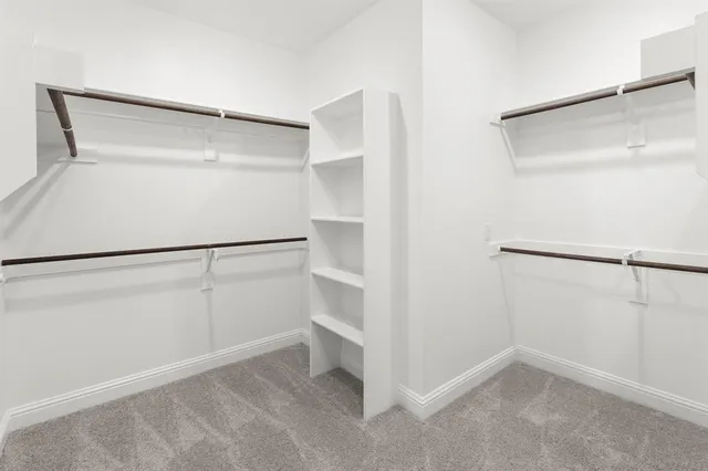 a view of an empty walk in closet