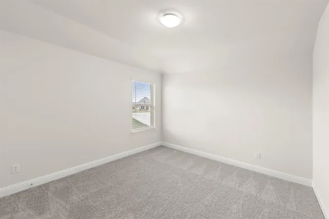 an empty room with a empty space and window