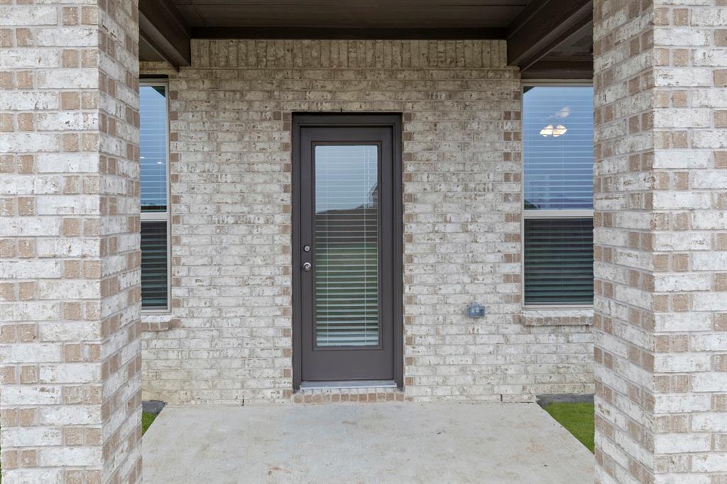 2029 Gladd Road Royse City, TX 75189 - Photo 25 of 27 a brick house with a door