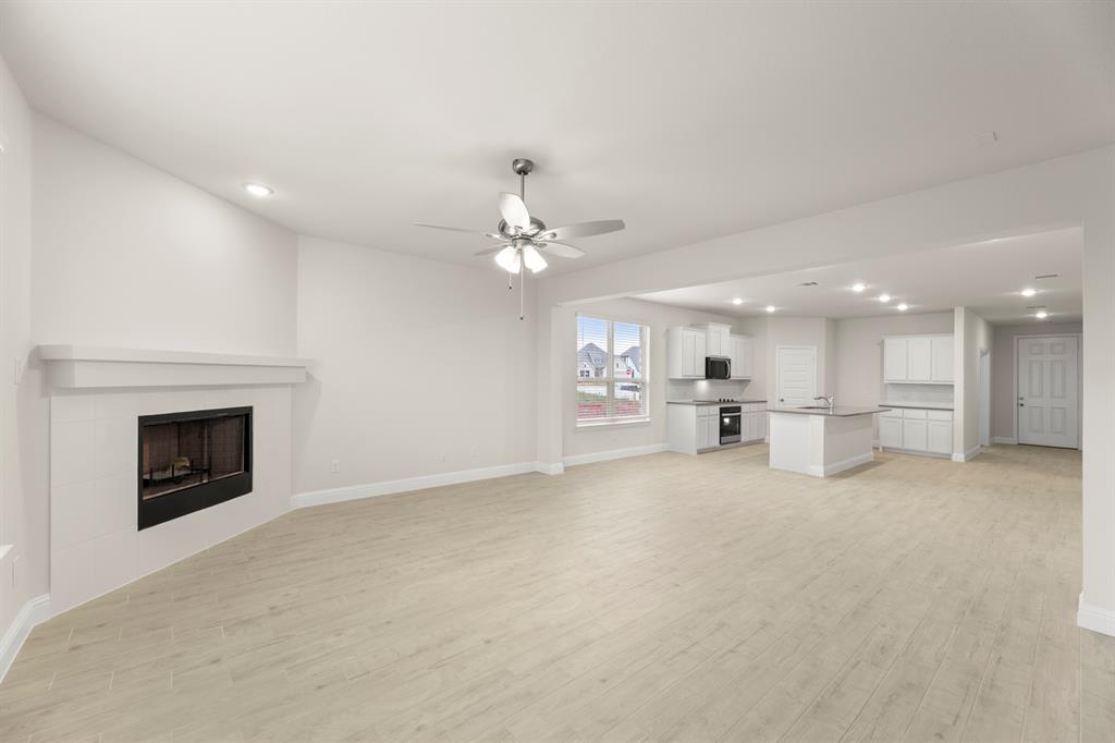 2029 Gladd Road Royse City, TX 75189 - Photo 10 of 27 a view of a kitchen with a sink and a fireplace