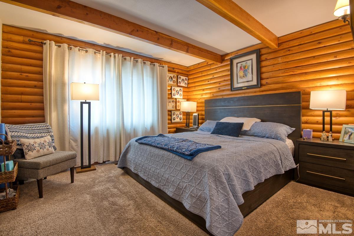 618 Jeff Lane Stateline, NV 89449 - Photo 16 of 37 a bedroom with a bed and a mirror