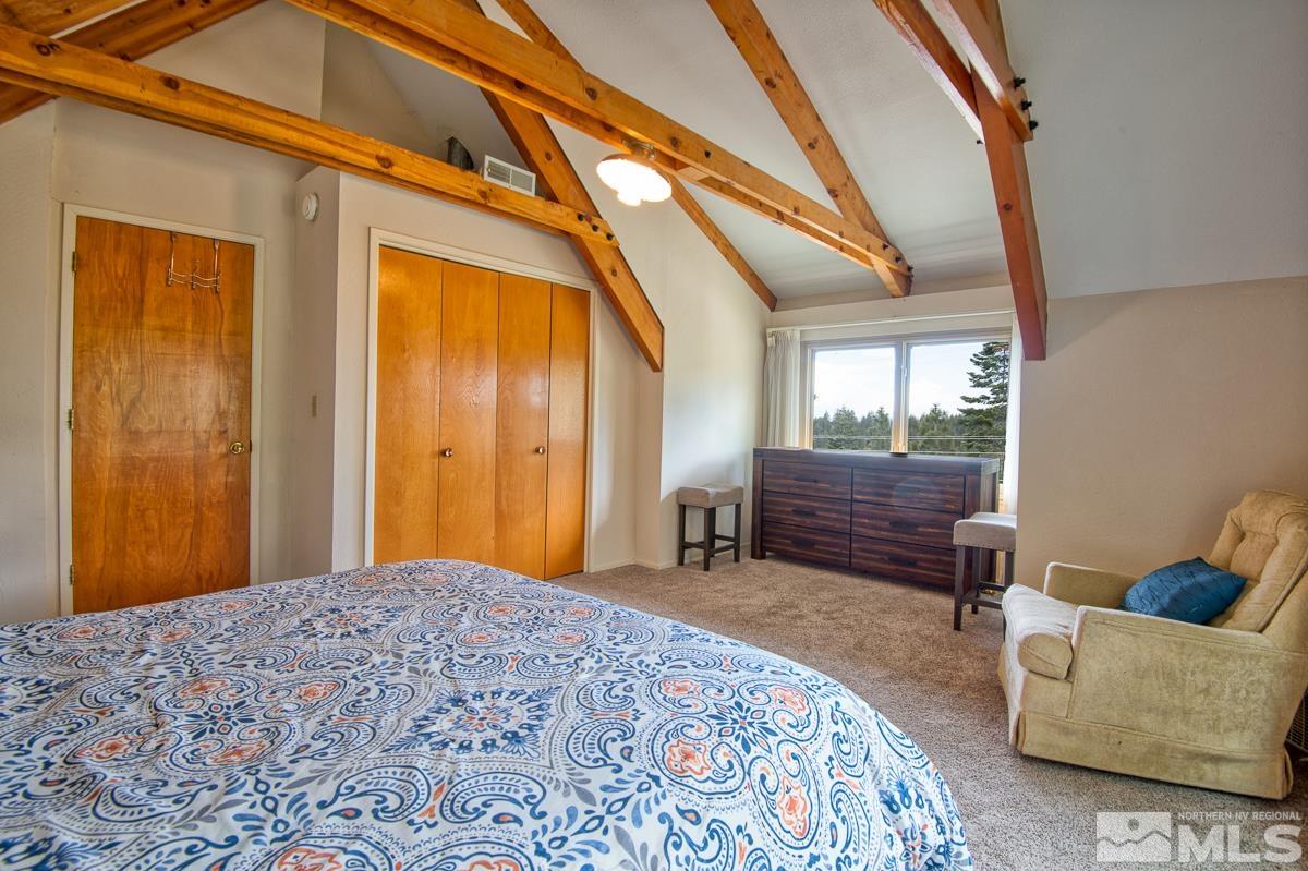 618 Jeff Lane Stateline, NV 89449 - Photo 20 of 37 a bedroom with a bed and a couch