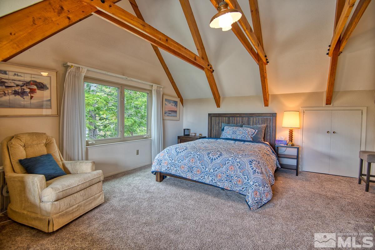 618 Jeff Lane Stateline, NV 89449 - Photo 21 of 37 a bedroom with a bed couch and a window