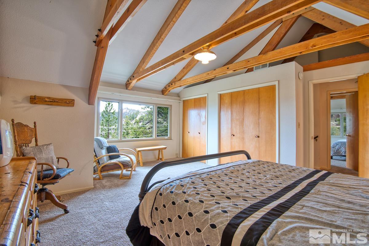 618 Jeff Lane Stateline, NV 89449 - Photo 23 of 37 a bedroom with a bed and a table