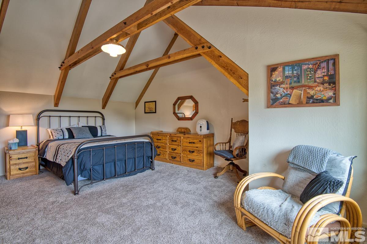 618 Jeff Lane Stateline, NV 89449 - Photo 24 of 37 a bedroom with furniture and a window