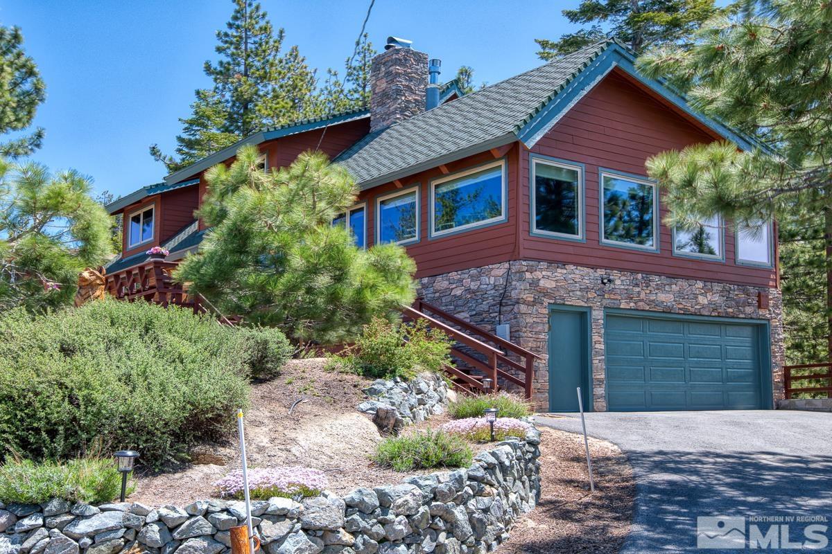618 Jeff Lane Stateline, NV 89449 - Photo 3 of 37 a front view of a house with a yard and garage
