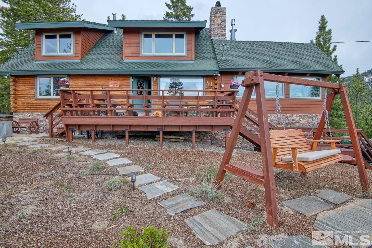 618 Jeff Lane Stateline, NV 89449 - Photo 32 of 37 a backyard of a house with wooden deck and outdoor seating