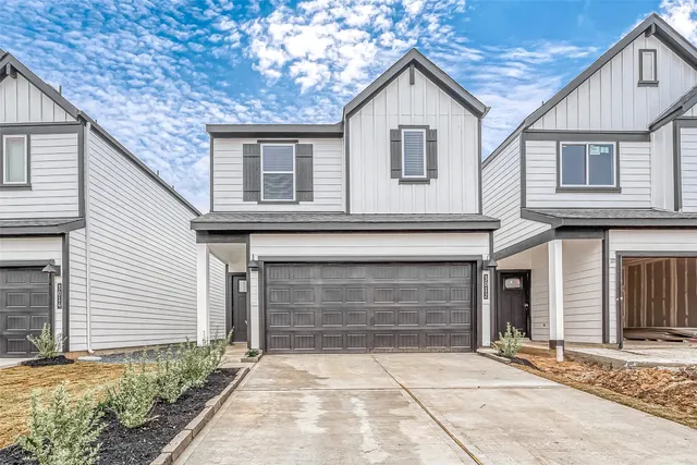 a front view of a house with yard