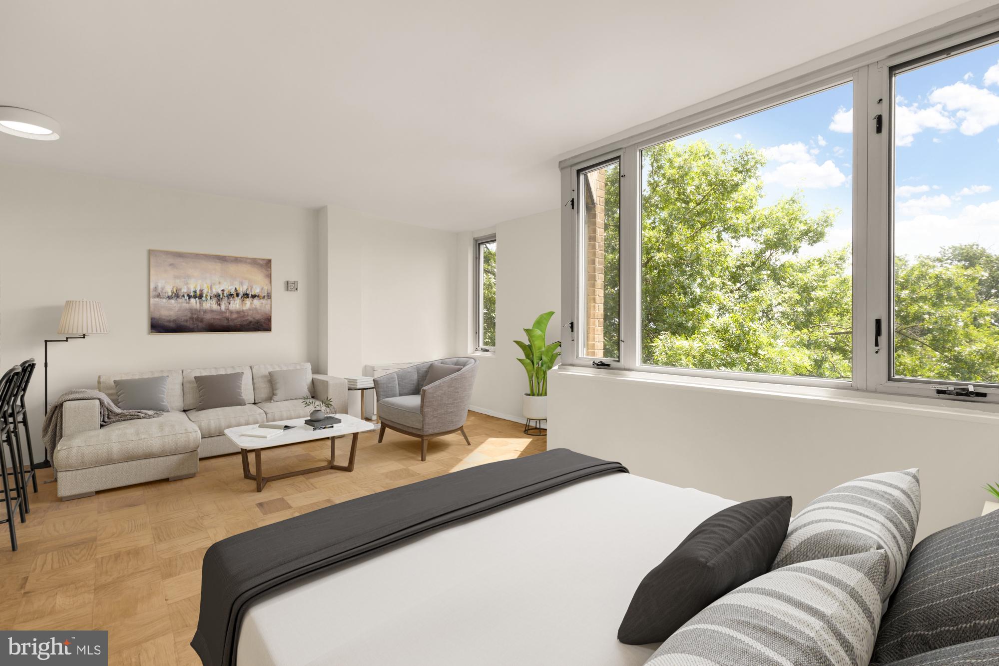 2800 Wisconsin Avenue Northwest, Unit 609 Washington, DC 20007 - Photo 13 of 20 a bedroom with a bed couch and large window