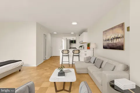 a bathroom with a bathtub shower sink vanity and mirror