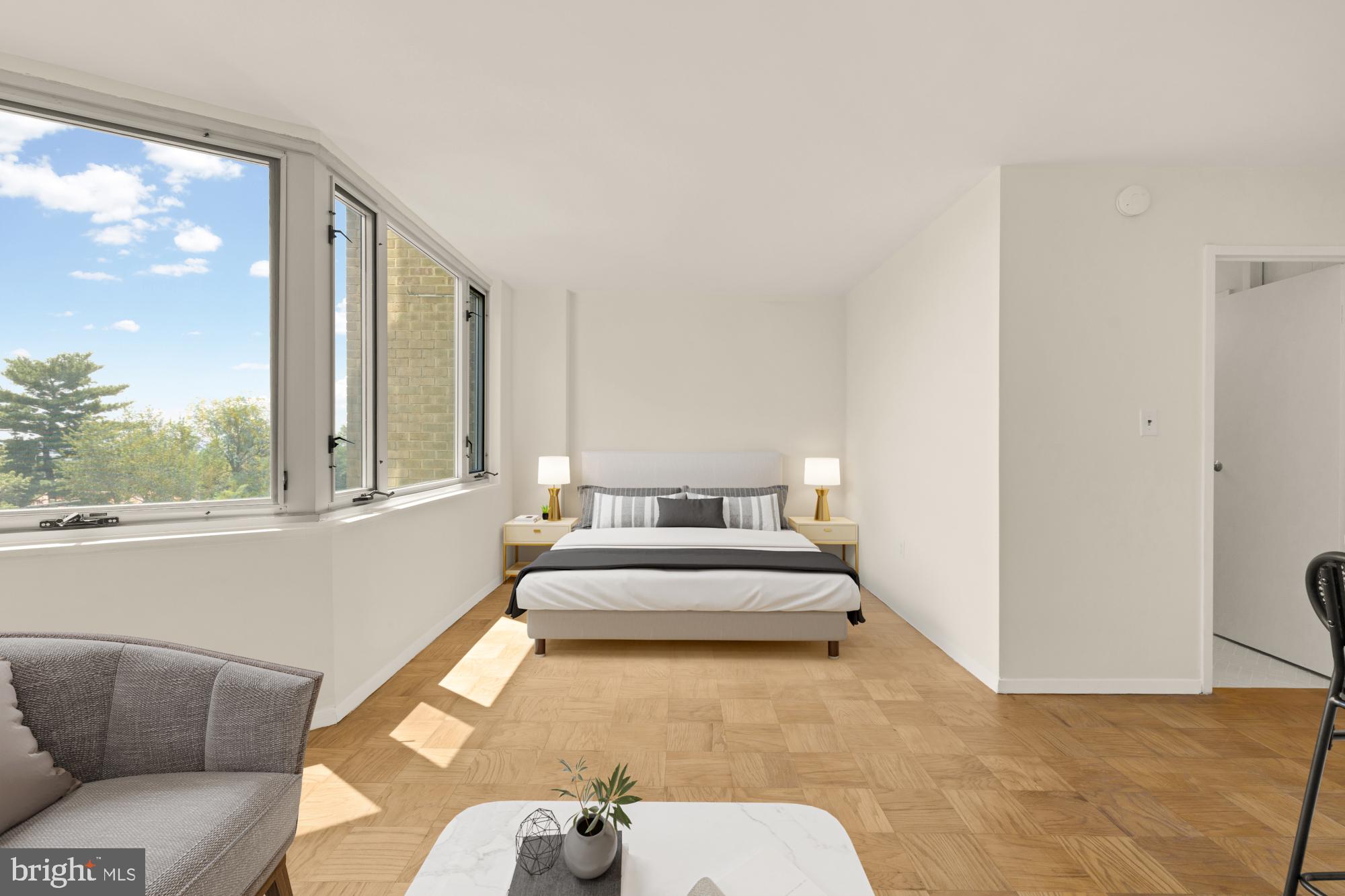2800 Wisconsin Avenue Northwest, Unit 609 Washington, DC 20007 - Photo 18 of 20 a living room with furniture and a large window