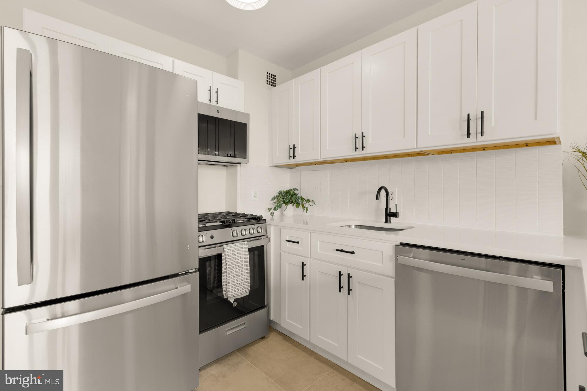 2800 Wisconsin Avenue Northwest, Unit 609 Washington, DC 20007 - Photo 7 of 20 a kitchen with white cabinets and white appliances