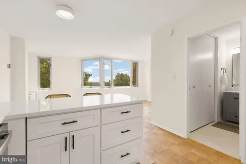 a view of kitchen island with furniture and wooden floor