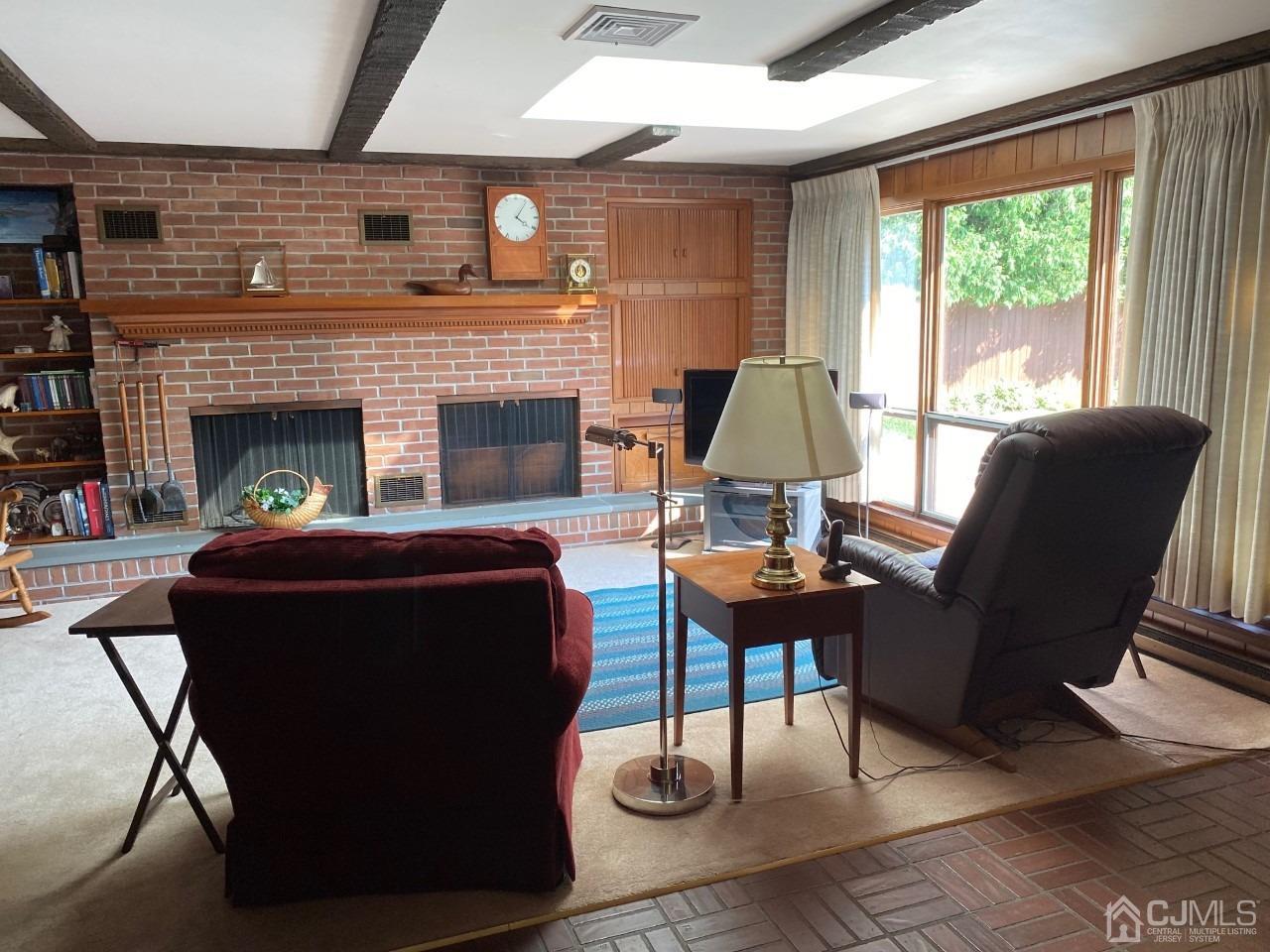 2 O Brien Road Cranbury, NJ 08512 - Photo 15 of 35 a living room with furniture and a fireplace