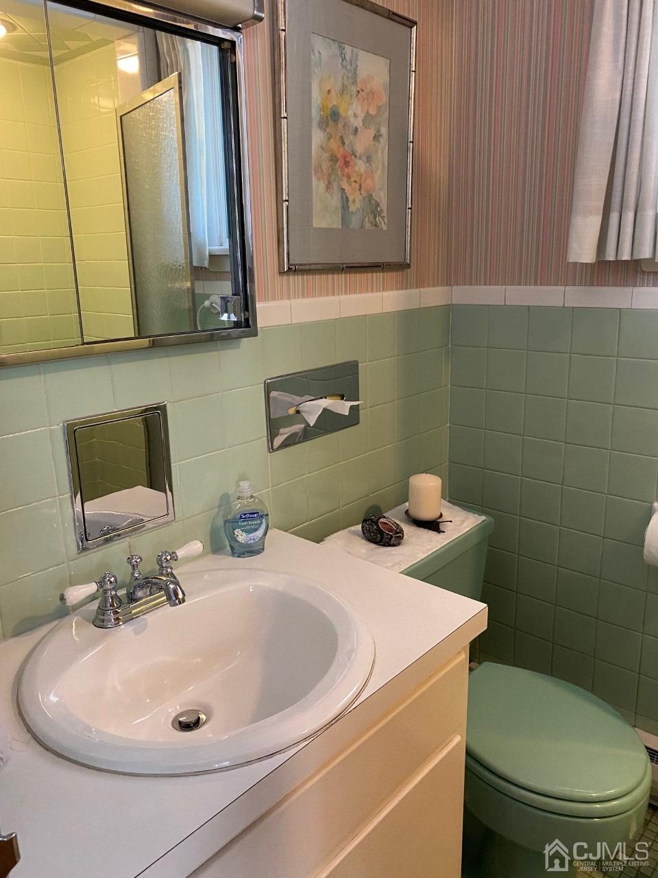 2 O Brien Road Cranbury, NJ 08512 - Photo 16 of 35 a bathroom with a toilet sink and mirror