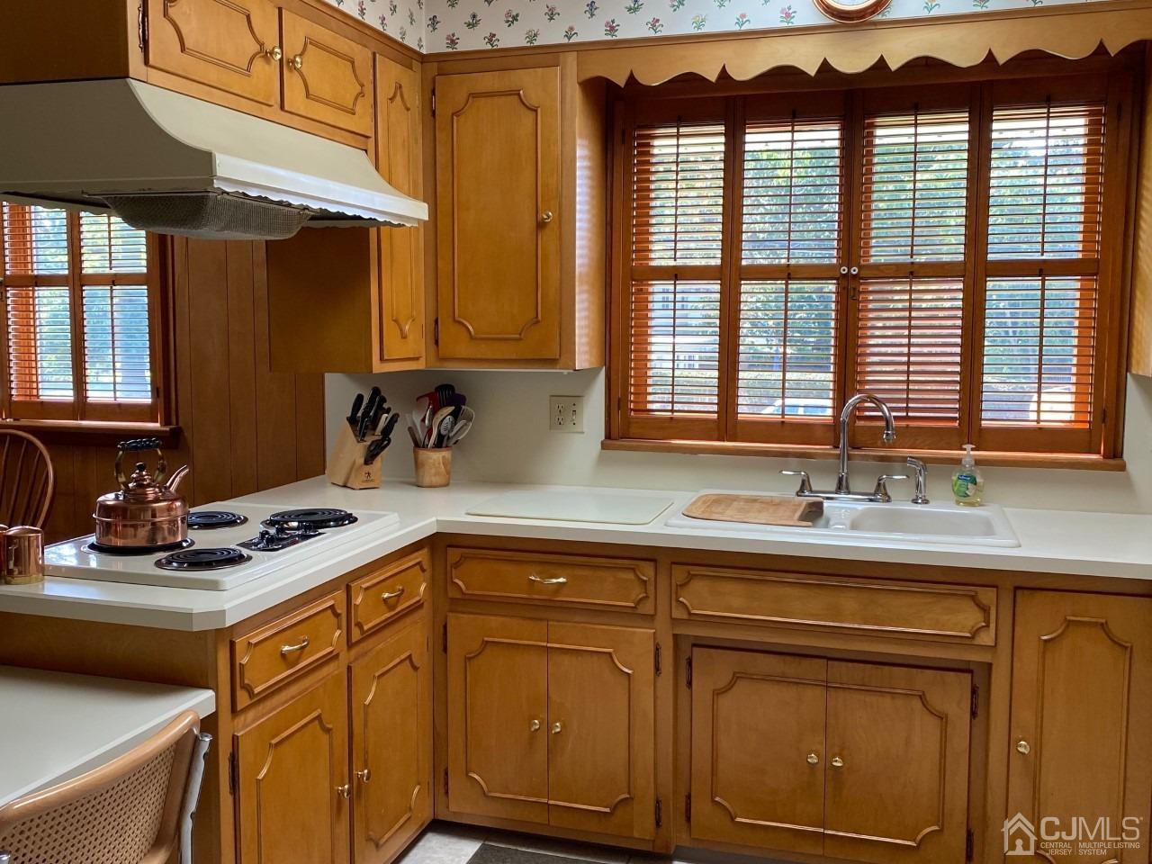 2 O Brien Road Cranbury, NJ 08512 - Photo 17 of 35 a kitchen with stainless steel appliances granite countertop a sink and cabinets