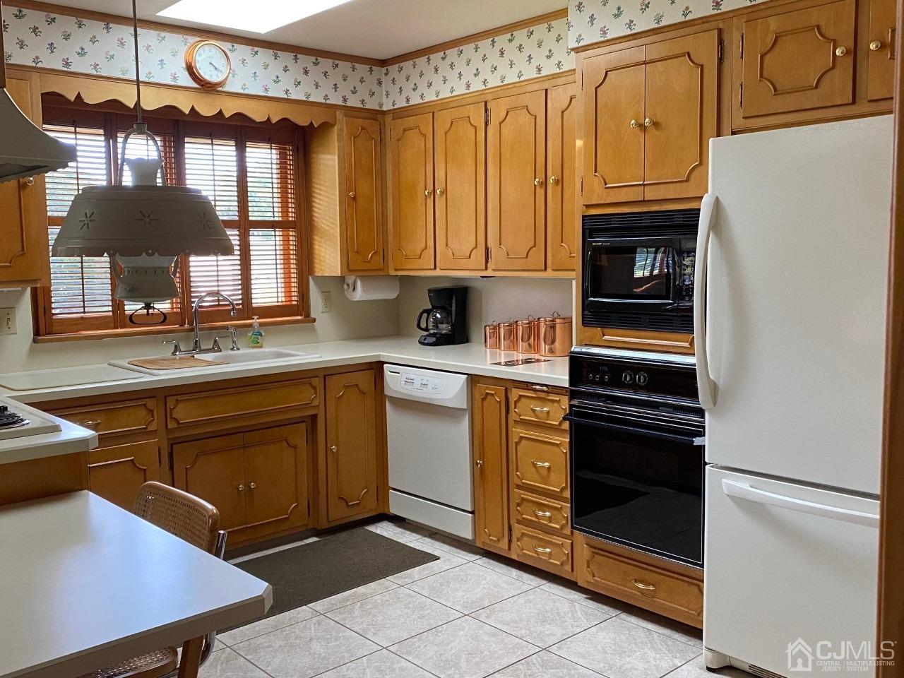 2 O Brien Road Cranbury, NJ 08512 - Photo 20 of 35 a kitchen with stainless steel appliances granite countertop a refrigerator and a stove top oven