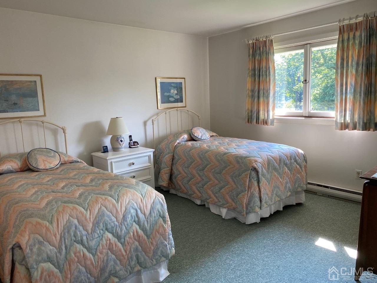 2 O Brien Road Cranbury, NJ 08512 - Photo 28 of 35 a bedroom with two beds and a window