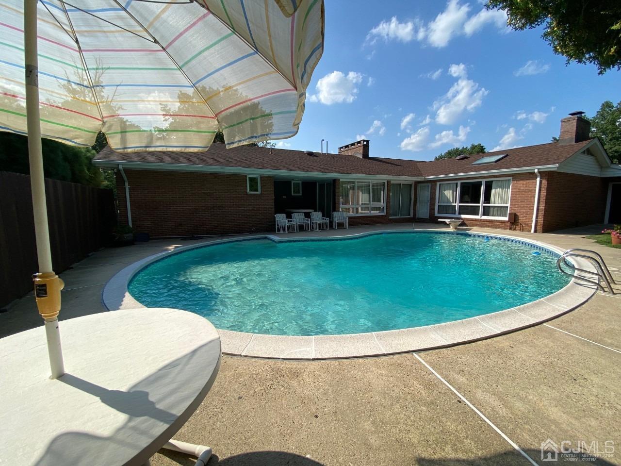 2 O Brien Road Cranbury, NJ 08512 - Photo 33 of 35 a view of a house with a backyard porch and sitting area