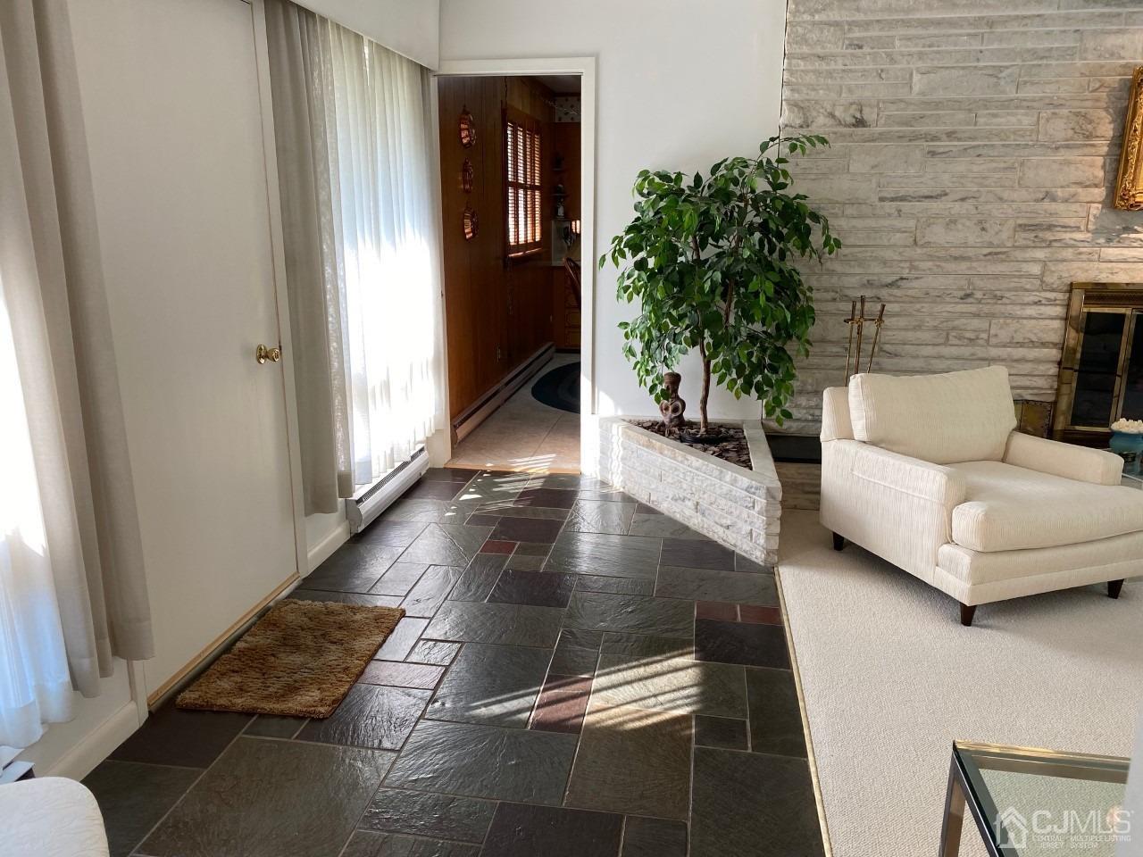 2 O Brien Road Cranbury, NJ 08512 - Photo 5 of 35 a living room with furniture and a potted plant