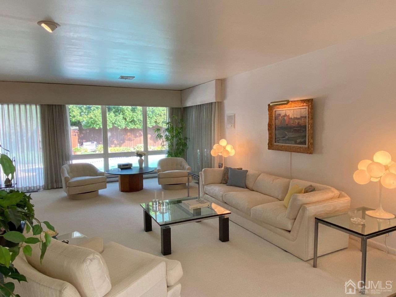 2 O Brien Road Cranbury, NJ 08512 - Photo 8 of 35 a living room with furniture and a large window