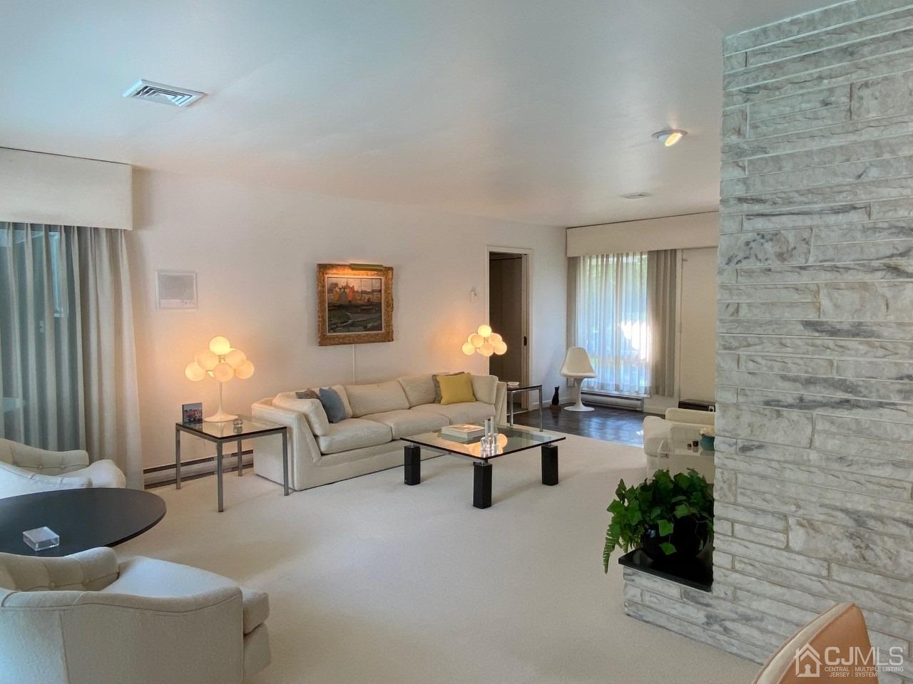 2 O Brien Road Cranbury, NJ 08512 - Photo 10 of 35 a living room with furniture and a lamp