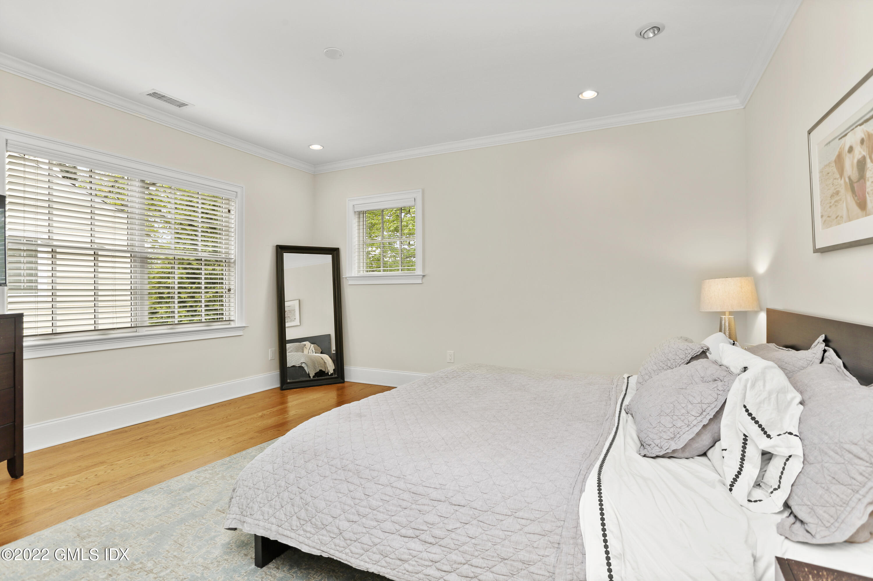 2 Pierce Road Riverside, CT 06878 - Photo 13 of 26 a bedroom with a bed and wooden floor