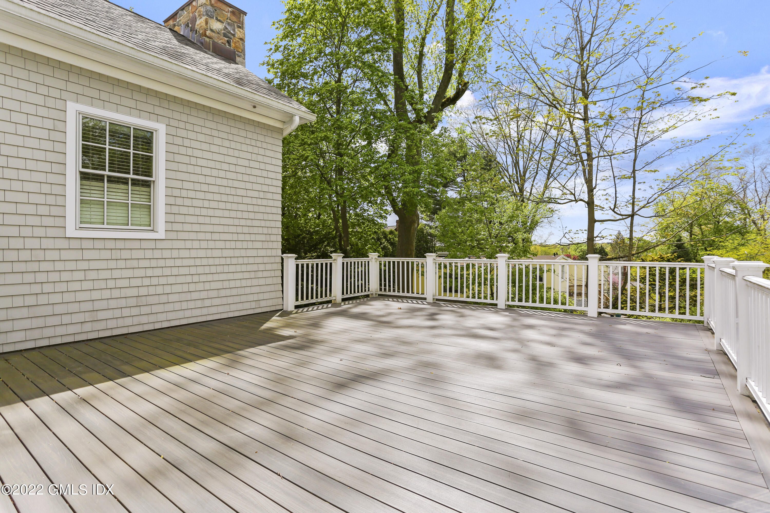 2 Pierce Road Riverside, CT 06878 - Photo 18 of 26 a view of a backyard with a wooden deck