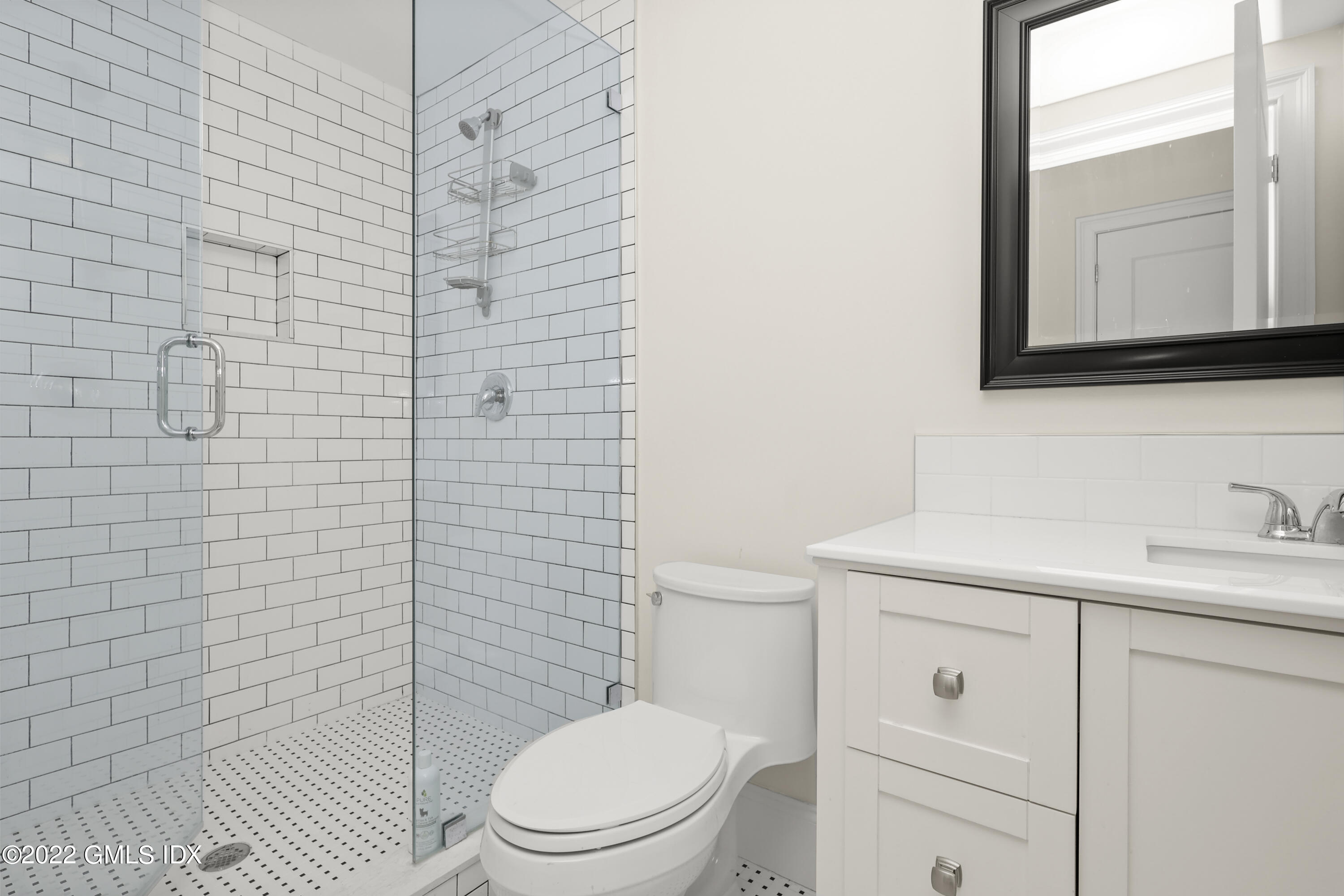 2 Pierce Road Riverside, CT 06878 - Photo 21 of 26 a bathroom with a toilet a sink a vanity and mirror