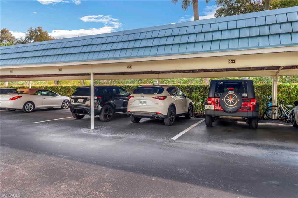 3055 Riviera Drive, Unit 201 Naples, FL 34103 - Photo 15 of 18 View of covered parking lot
