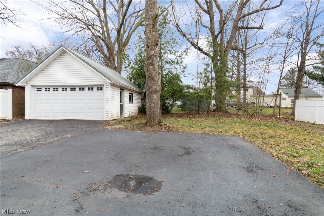 2214 Cleveland Road Wooster, OH 44691 - Photo 31 of 38 The spacious two car garage has an automatic door opener and on the side there is a mandoor. Lots of extra parking in this additional paved area.