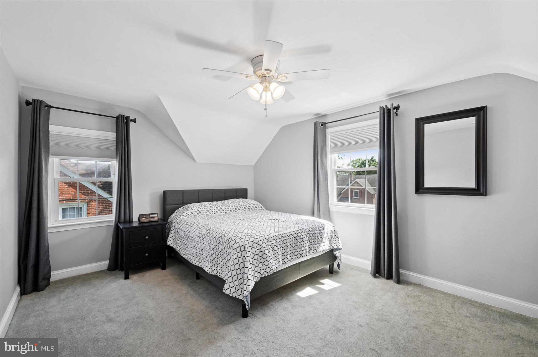 313 Edgemore Road Secane, PA 19018 - Photo 11 of 22 a bedroom with a bed next to a window