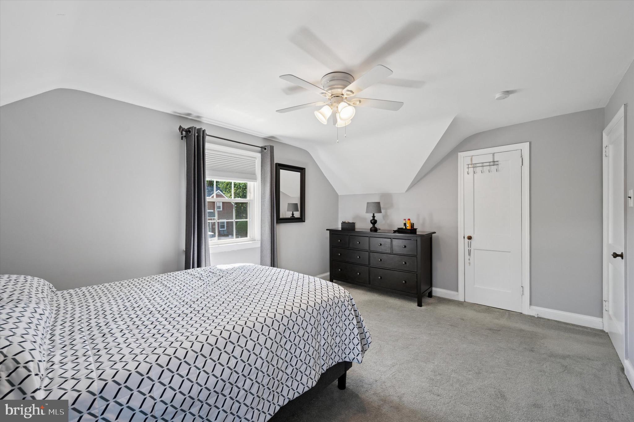 313 Edgemore Road Secane, PA 19018 - Photo 12 of 22 a bed room with a bed and a chandelier