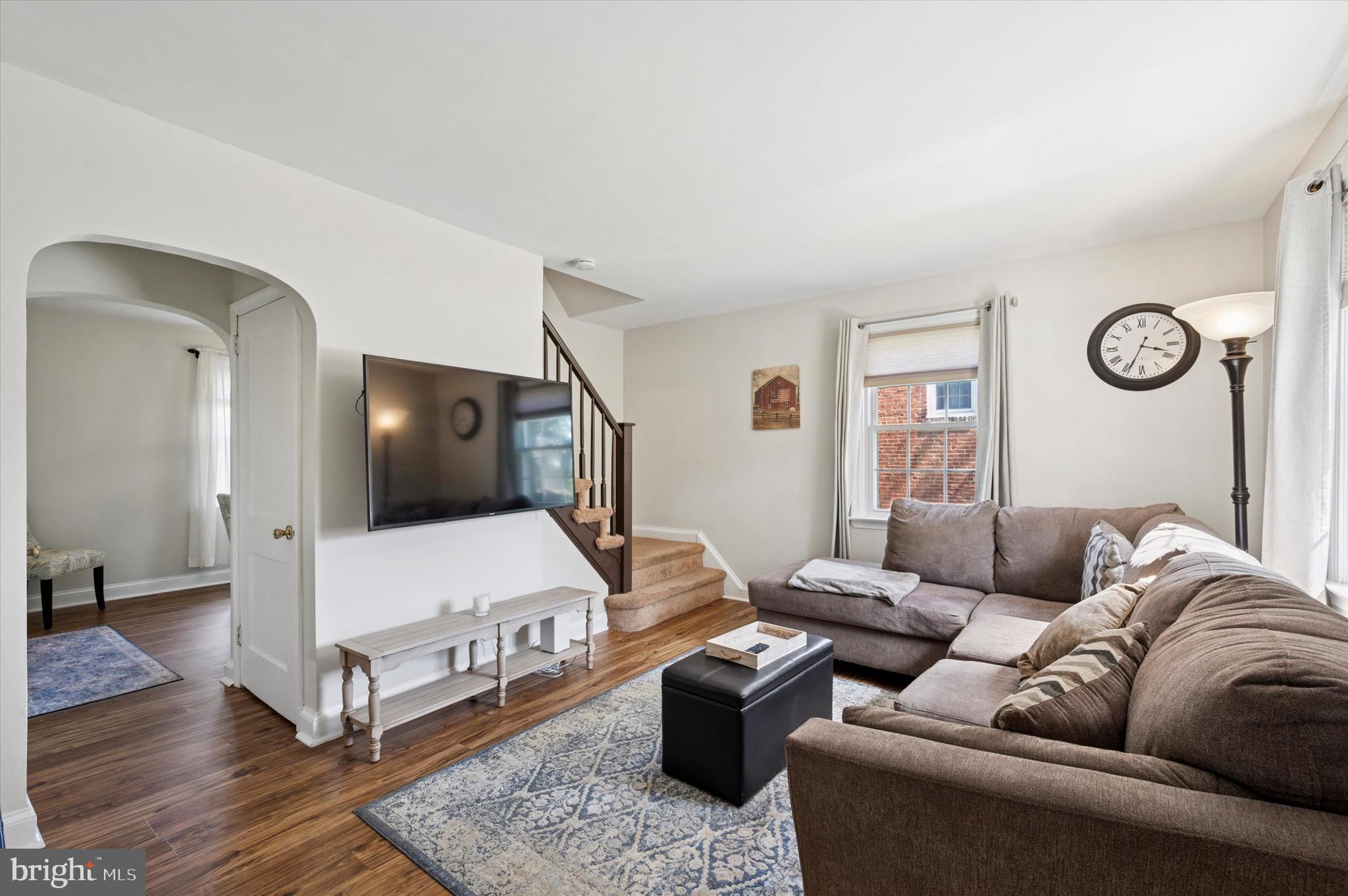 313 Edgemore Road Secane, PA 19018 - Photo 2 of 22 a living room with furniture and a flat screen tv